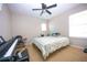 Bright bedroom with a window, neutral walls, and a ceiling fan, perfect for a music lover with a keyboard at 2169 Rose Blvd, Winter Haven, FL 33881