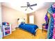 Bright bedroom with a twin bed, ceiling fan, and closet space, ideal for a room at 2169 Rose Blvd, Winter Haven, FL 33881