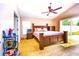 Cozy bedroom with vaulted ceiling, sliding glass door, and comfortable furnishings at 2169 Rose Blvd, Winter Haven, FL 33881