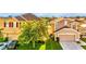 Exterior view of two-story homes with attached garages and green lawns at 2169 Rose Blvd, Winter Haven, FL 33881