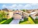 Charming two-story home featuring well-maintained landscaping and an attached two-car garage at 2169 Rose Blvd, Winter Haven, FL 33881
