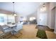 Inviting living room boasting a high ceiling, neutral walls, ample natural light, and a separate dining area at 2169 Rose Blvd, Winter Haven, FL 33881