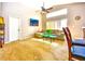 Comfortable living area with a cozy sofa, TV, and a large window, perfect for relaxation at 2169 Rose Blvd, Winter Haven, FL 33881