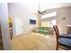 Relaxing living room with comfortable seating, large windows, vaulted ceilings, and a ceiling fan at 2169 Rose Blvd, Winter Haven, FL 33881