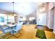 Open-concept living area with dining space, comfortable seating, and large windows at 2169 Rose Blvd, Winter Haven, FL 33881