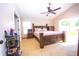 Cozy main bedroom with large bed, vaulted ceiling, ceiling fan, and plenty of natural light at 2169 Rose Blvd, Winter Haven, FL 33881