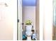 Neat toilet room with a standard toilet and floral decorations at 2169 Rose Blvd, Winter Haven, FL 33881