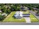 An aerial view showcases this quaint home's perimeter and its placement within the community at 2218 Melbourne Ave, Haines City, FL 33844