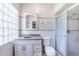 Well-lit bathroom featuring vanity, shower and tiled walls at 2218 Melbourne Ave, Haines City, FL 33844