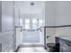 Updated bathroom featuring black and white tile, modern fixtures, and a walk in shower at 2218 Melbourne Ave, Haines City, FL 33844