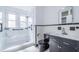 Beautiful bathroom features walk in shower, black and white tile, and modern fixtures at 2218 Melbourne Ave, Haines City, FL 33844