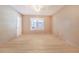 Cozy bedroom with neutral walls, updated light fixture and light tile flooring at 2218 Melbourne Ave, Haines City, FL 33844
