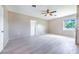 Generous bedroom with light tile floors, neutral walls and a ceiling fan at 2218 Melbourne Ave, Haines City, FL 33844