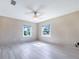 Bright, spacious bedroom with ceiling fan and a view of the outdoors at 2218 Melbourne Ave, Haines City, FL 33844