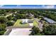 This exterior view features a metal roof, solar panels and well-manicured lawn, capturing curb appeal at 2218 Melbourne Ave, Haines City, FL 33844