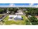 This home features a metal roof and solar panels, situated on a well-maintained lot in a serene neighborhood at 2218 Melbourne Ave, Haines City, FL 33844