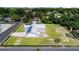 Beautiful home with a metal roof and solar panels, nestled on a spacious lot with a driveway at 2218 Melbourne Ave, Haines City, FL 33844