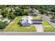 Charming home featuring a metal roof with solar panels, carport, and a well-maintained lawn on a sunny day at 2218 Melbourne Ave, Haines City, FL 33844