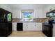 Modern kitchen features white cabinetry, stainless steel appliances, and bright natural lighting at 2218 Melbourne Ave, Haines City, FL 33844