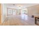 Open concept living room showcasing archways, light tile flooring and neutral paint at 2218 Melbourne Ave, Haines City, FL 33844