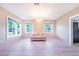 Bright living room featuring a comfortable sofa and natural light streaming through the windows at 2218 Melbourne Ave, Haines City, FL 33844