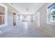 Bright and airy living space featuring tiled floors, neutral walls, and ample natural light at 2218 Melbourne Ave, Haines City, FL 33844