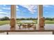 Beautiful view of the pool framed by decorative accents on a wooden table, enhancing the serene outdoor space at 2300 Scenic N Hwy # 51, Lake Wales, FL 33898