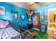Bright blue ' bedroom with fun decor, built-in bed, and baseball accents at 237 Manatee Rd, Winter Haven, FL 33884