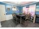 Charming dining area features a dark table and comfortable upholstered chairs at 237 Manatee Rd, Winter Haven, FL 33884