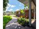 Charming front porch with decorative plants and brick pathway creating a welcoming entrance at 237 Manatee Rd, Winter Haven, FL 33884