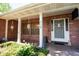 Covered porch with brick columns and decorative accents offering a cozy outdoor space at 237 Manatee Rd, Winter Haven, FL 33884