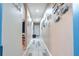 Inviting hallway with recessed lighting and art-lined walls leading to other rooms at 237 Manatee Rd, Winter Haven, FL 33884