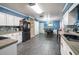 Bright kitchen featuring white cabinets, modern appliances, and dining space at 237 Manatee Rd, Winter Haven, FL 33884