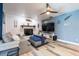 Relaxing living room with a fireplace, soft gray sofa, and stylish nautical decor at 237 Manatee Rd, Winter Haven, FL 33884
