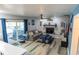 Cozy living room with fireplace, comfortable seating, and sliding door to hot tub at 237 Manatee Rd, Winter Haven, FL 33884
