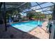 Enclosed pool area featuring brick pavers, inground pool, and black metal screening enclosure at 237 Manatee Rd, Winter Haven, FL 33884