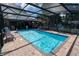 Screened-in pool with brick paver patio and plenty of space for outdoor seating at 237 Manatee Rd, Winter Haven, FL 33884
