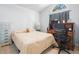 Cozy bedroom featuring a vaulted ceiling, desk, and neutral tones at 2538 Crown Ridge Cir, Kissimmee, FL 34744