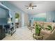 Comfortable living space with tile floors, ceiling fan, and view to outdoor patio at 2538 Crown Ridge Cir, Kissimmee, FL 34744