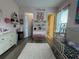 Bright bedroom showcases lovely design and access to en suite bathroom and walk-in closet at 25863 Crossings Bluff Ln, Sorrento, FL 32776
