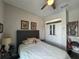 Comfortable bedroom with a cozy bed, closet, and decorative artwork at 25863 Crossings Bluff Ln, Sorrento, FL 32776