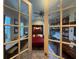 Charming bedroom with Murphy bed, ceiling fan and bonus desk with shelves at 25863 Crossings Bluff Ln, Sorrento, FL 32776