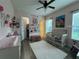 Cozy bedroom features a charming decor with pink walls and themed accents at 25863 Crossings Bluff Ln, Sorrento, FL 32776