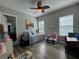 Comfortable bedroom featuring tile floors, lots of natural light, and access to a full bathroom at 25863 Crossings Bluff Ln, Sorrento, FL 32776