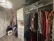 Well-organized walk-in closet with custom shelving and ample space for clothes and accessories at 25863 Crossings Bluff Ln, Sorrento, FL 32776
