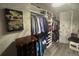 Organized walk-in closet with ample storage space, hanging rods, shelves, and a dresser at 25863 Crossings Bluff Ln, Sorrento, FL 32776