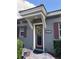 Inviting front entrance with a decorative door and well-maintained landscaping at 25863 Crossings Bluff Ln, Sorrento, FL 32776