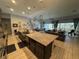 Expansive kitchen island open to the living room area at 25863 Crossings Bluff Ln, Sorrento, FL 32776
