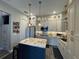 Modern kitchen with granite countertops, a kitchen island, and stainless steel appliances at 25863 Crossings Bluff Ln, Sorrento, FL 32776