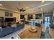 Spacious living room showcases an open floor plan connecting dining area, kitchen, and cozy seating space at 25863 Crossings Bluff Ln, Sorrento, FL 32776
